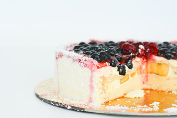 Fresh fruit cake on white background