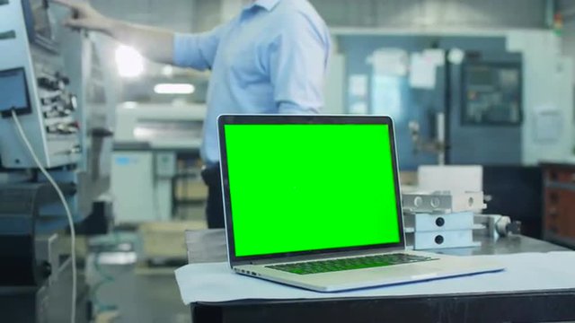 Notebook with Green Screen in Industrial Environment Mock-up