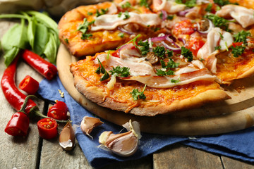 Tasty pizza with vegetables on table close up