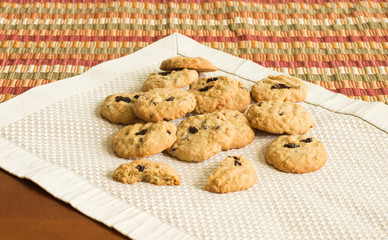 homemade cranberry oatmeal cookies on placemat table.