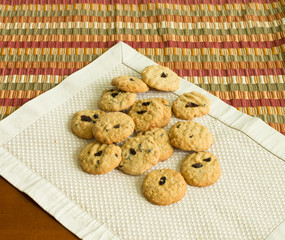 homemade cranberry oatmeal cookies on the placemat table.