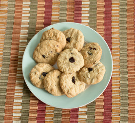 homemade cranberry oatmeal cookies on the placemat table.