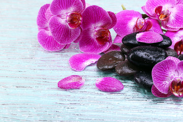 Violet orchid and zen stones close-up