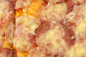 
Pizza with salami as background