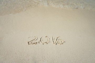 Handwriting inscription 2016 on the beach