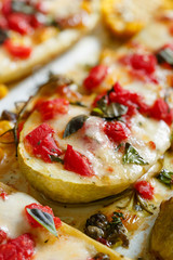 Zucchini stuffed with vegetables, mozzarella cheese and herbs