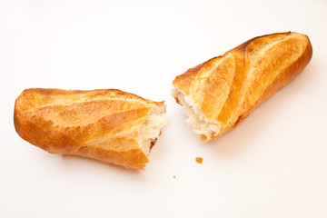 Fresh baked bread loaf broken in half