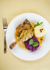 Duck leg with potato dumplings, red cabbage