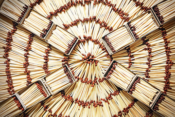 Matchboxes with matches on a background of matches