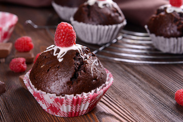 Delicious cupcakes with berries on table close up