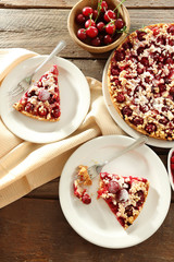 Tasty homemade pie with cherries on table close up