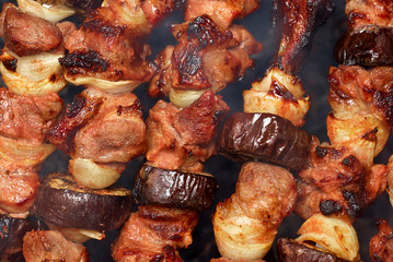 barbecue from meat and vegetables on fire