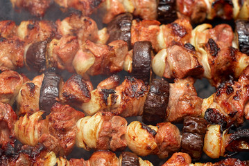 barbecue from meat and vegetables on fire