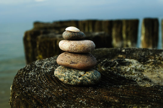 Fototapeta The tower of rocks on the breakwater 12