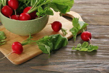 Fresh red radish on wooden table, closeup