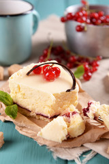 Tasty cheesecake with berries on table close up