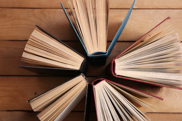 Heart of books, on wooden background