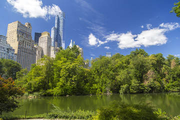 Central Park South skyline from Central Park Lake in New York City - obrazy, fototapety, plakaty