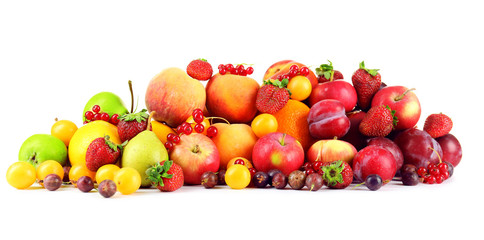 Fototapeta na wymiar Heap of fresh fruits and berries isolated on white