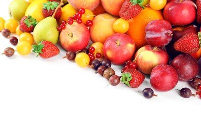 Heap of fresh fruits and berries  isolated on white