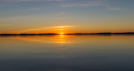 Landscape on the lake at sunset with reflection.