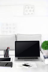 Modern workplace with laptop, close up