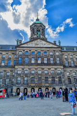 Obraz premium The Royal Palace of Amsterdam on a sunny day. The former Amsterdam town hall, now one of the three palaces in the Netherlands, which are at the disposal of the monarch.