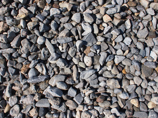 Background from small gray stones on the coast