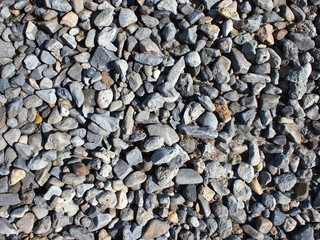 Background from gray stones on the coast