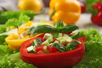 Fresh green salad in pepper on table close up