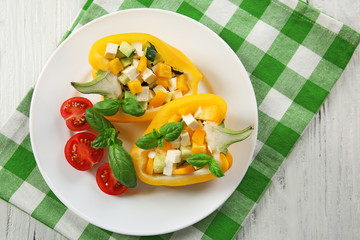 Fresh green salad in pepper on table close up
