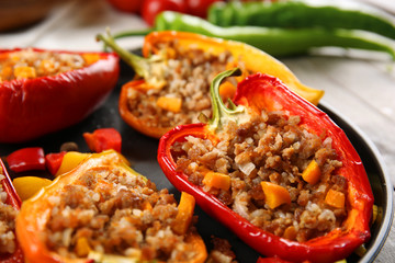 Stuffed peppers with vegetables on table close up