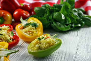 Stuffed peppers with vegetables on table close up