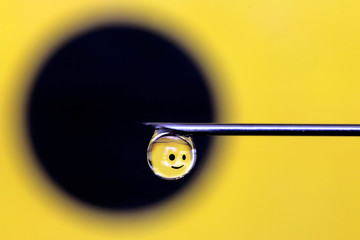 Smiley reflection on a droplet