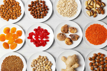 Set of different products on wooden table, closeup