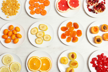 Set of orange products on wooden table, closeup