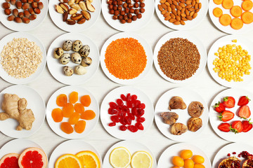 Set of orange products on wooden table, closeup