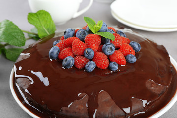 Delicious chocolate cake with summer berries, closeup