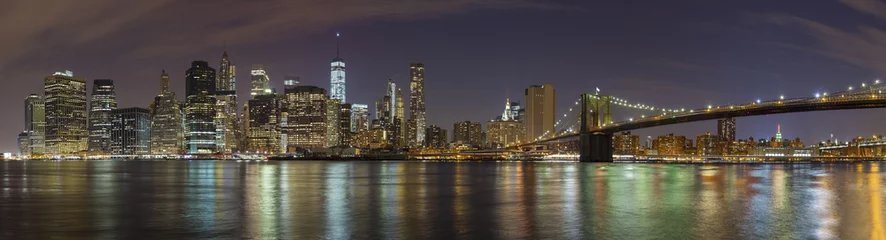 Gordijnen Manhattan skyline at night, New York City panoramic picture, USA © MaciejBledowski