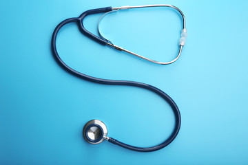 Stethoscope on blue background