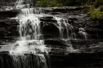 Mountain waterfall tumbling over rocks