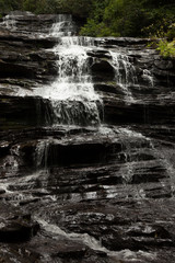 Mountain waterfall tumbling over rocks