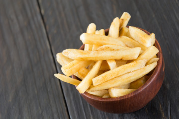 french fries on wood background