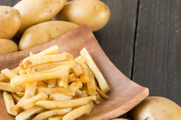 french fries on wood background