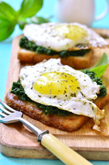 Toast with spinach and fried egg.