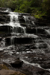 Mountain waterfall tumbling over rocks