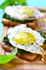 Toast with spinach and fried egg.