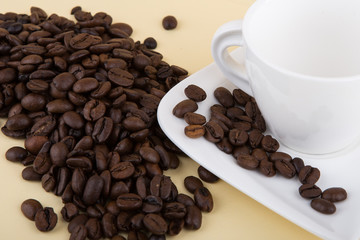 Coffee beans in coffee cup