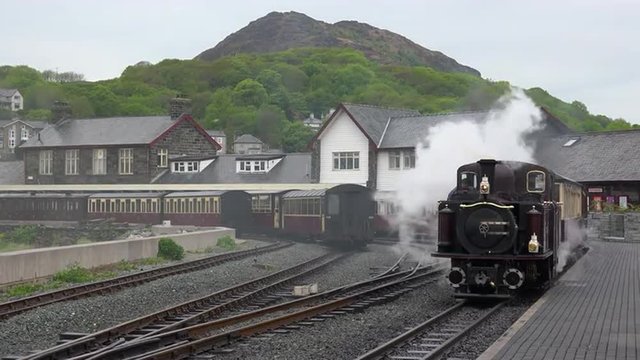 The Ffestiniog Railway steam train departs from the Porthmadog train station in Wales.