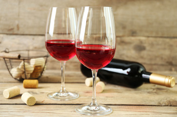 Still life of wine and bread on light background